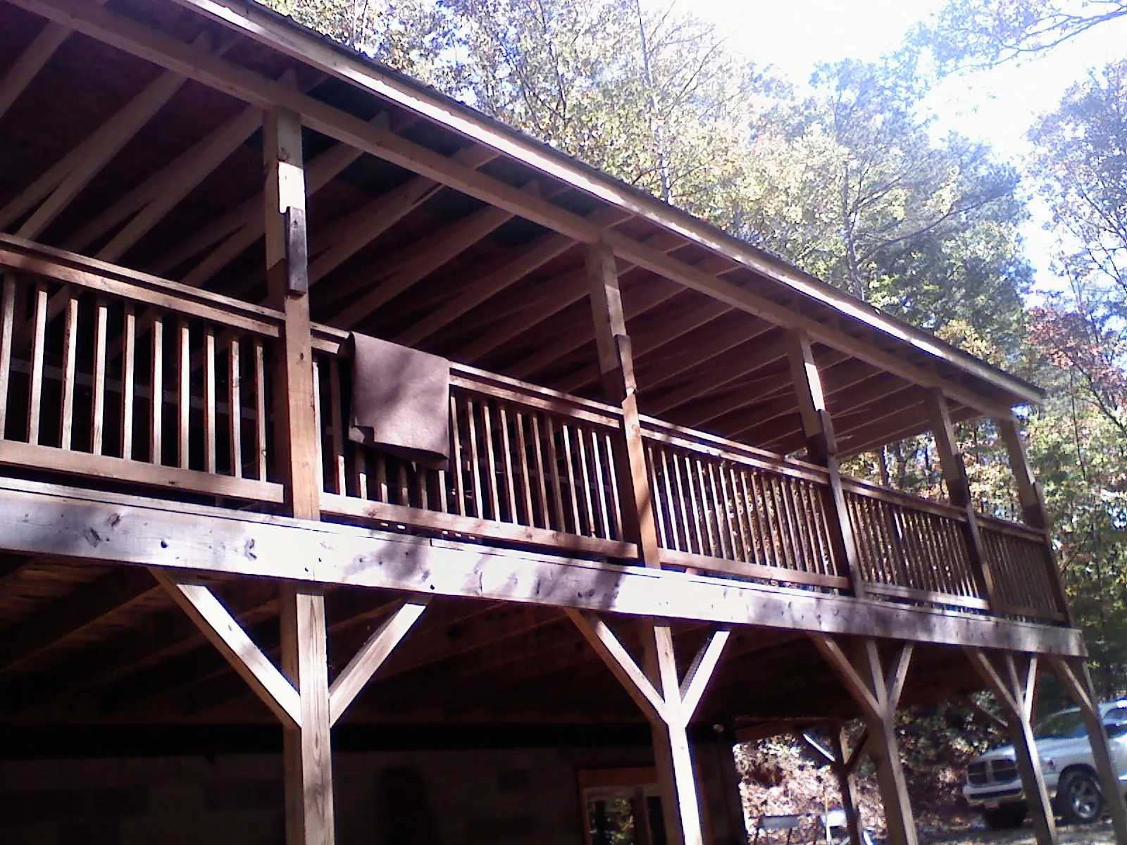 Timber framing under a new elevated porch and deck in Adams